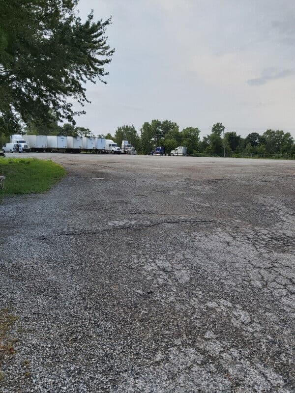 Secure fenced yard for truck and trailer parking near Windsor