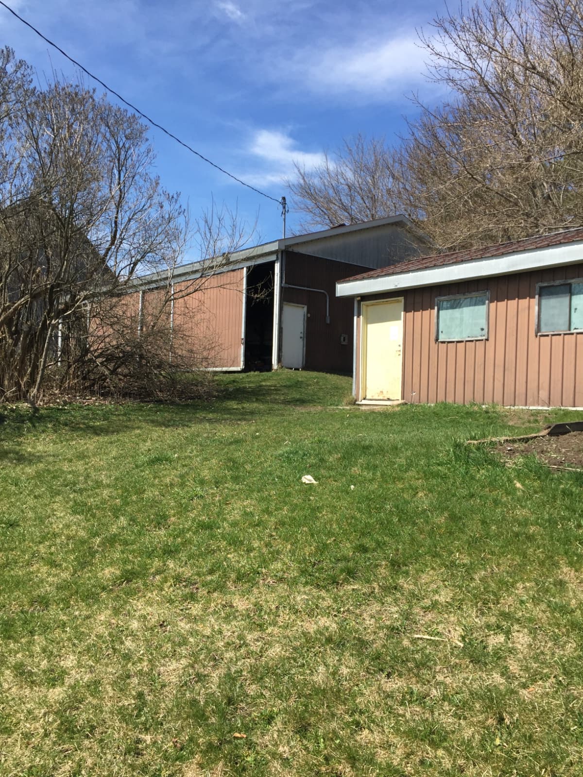 Large rural yard with drive-shed and barn for storage