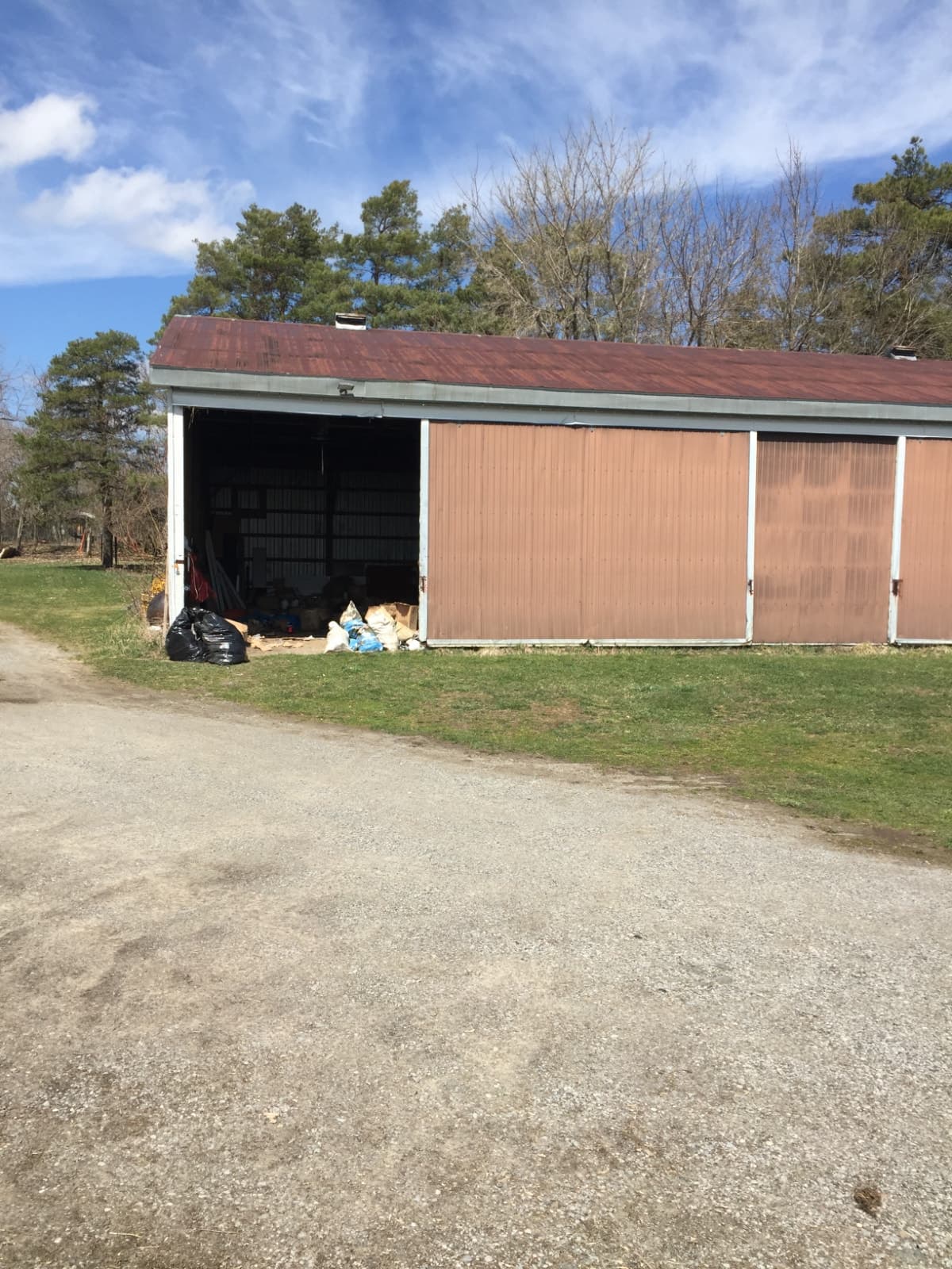 Large rural yard with drive-shed and barn for storage