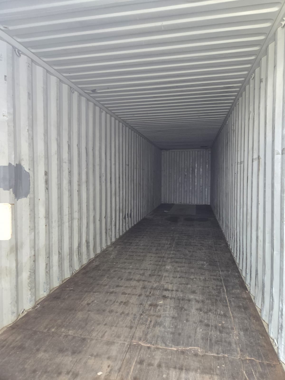 Large gated outdoor storage yard with 40ft container