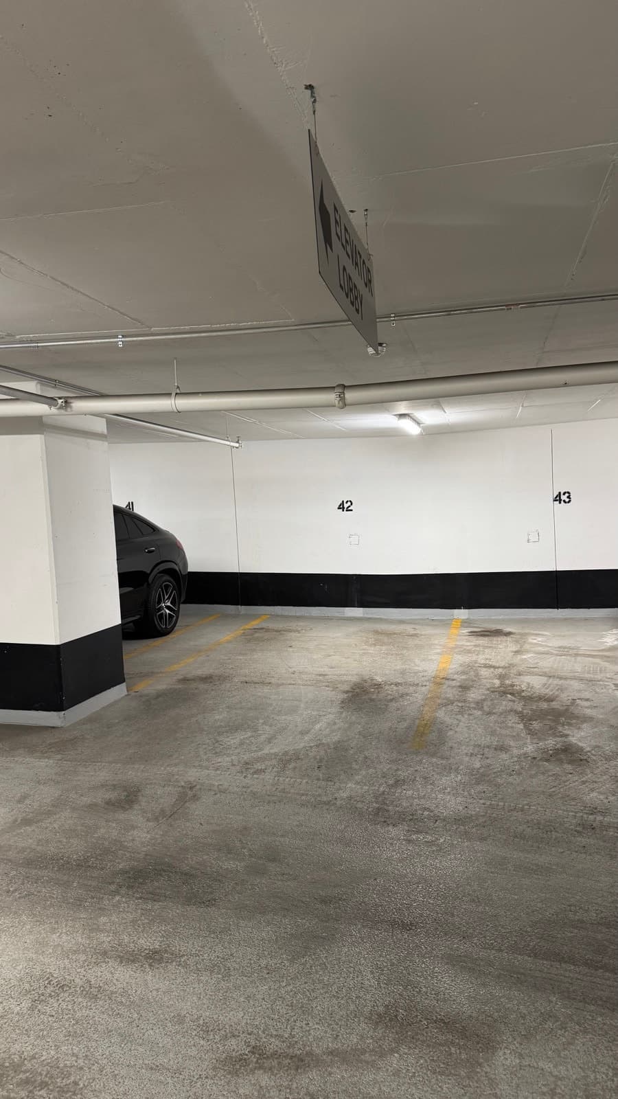 Indoor parking spot near Yorkville elevator lobby