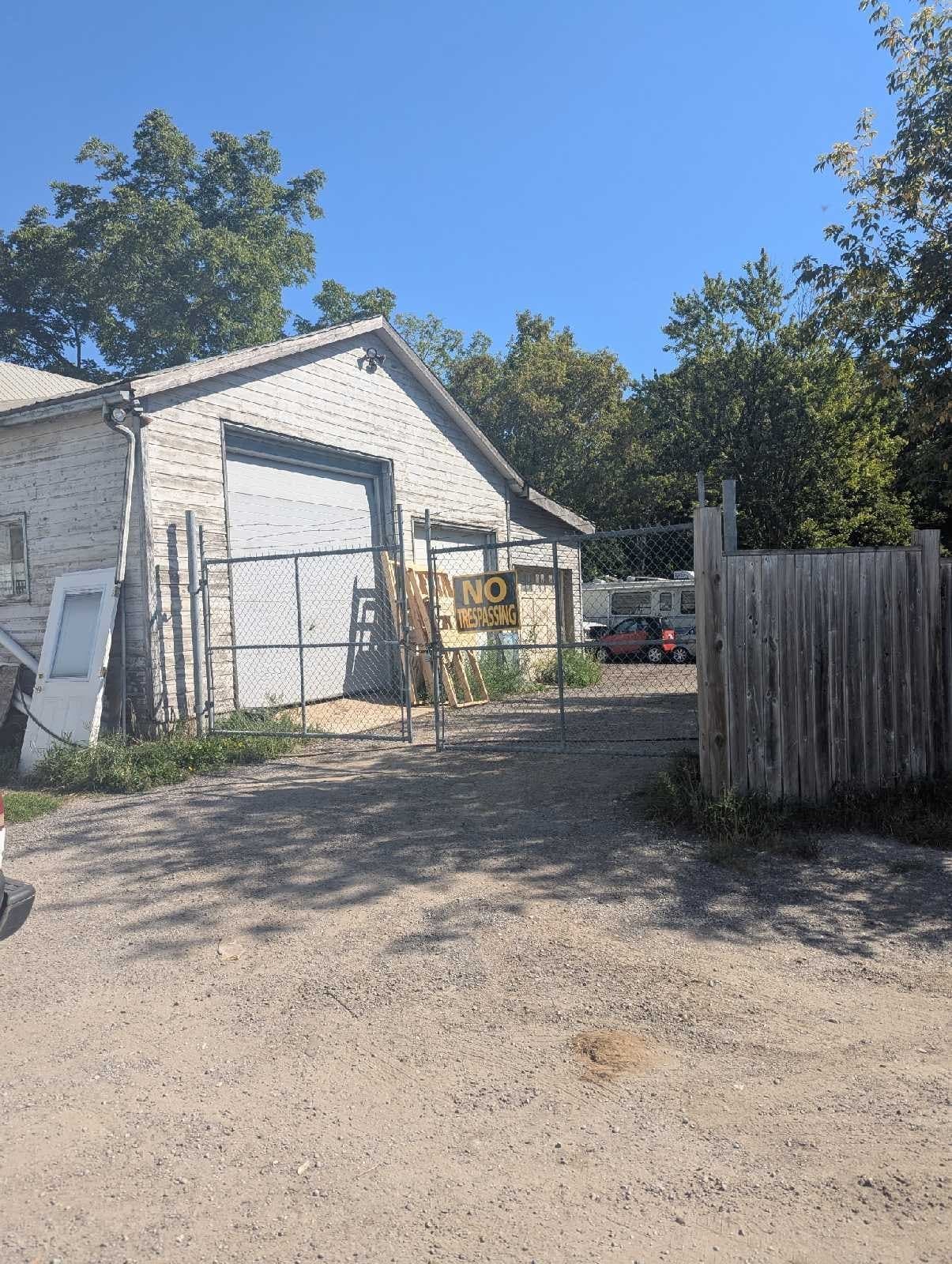 Outdoor gravel lot for vehicle and trailer storage