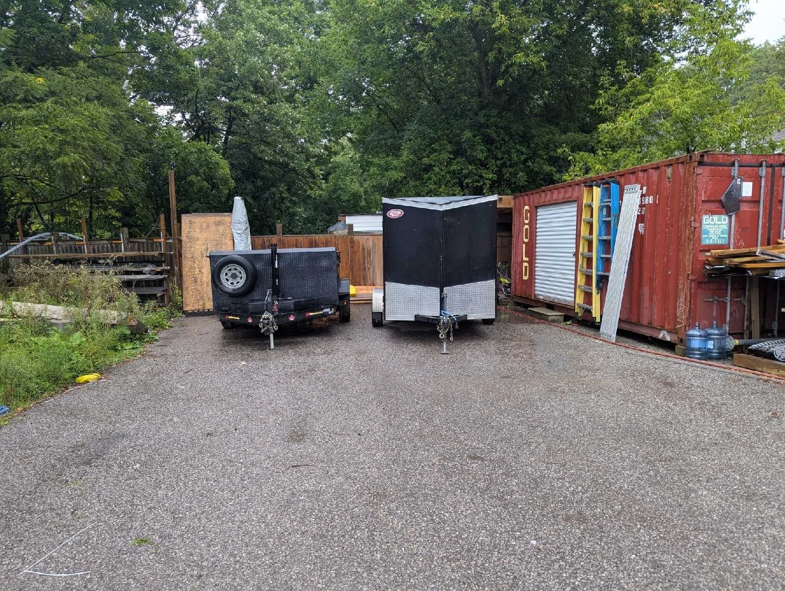 Outdoor gravel lot for vehicle and trailer storage