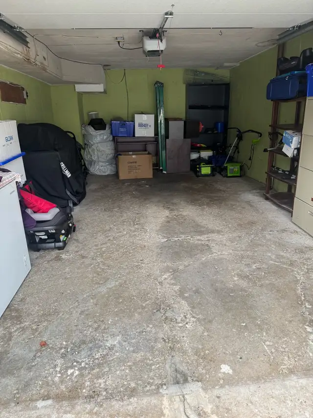 Inside the single garage, dry with a solid floor